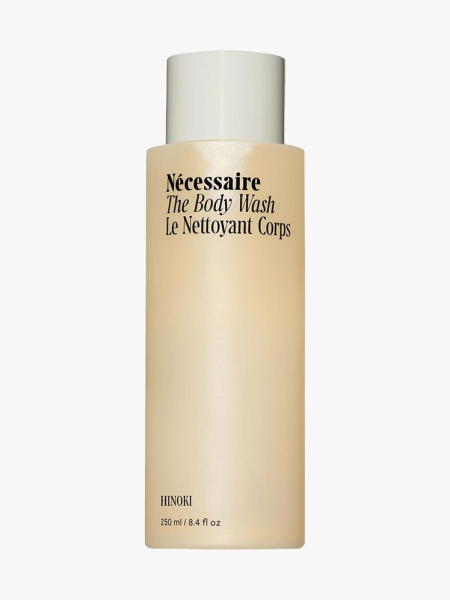 Nécessaire The Body Wash Hinoki bottle of body wash with beige cap on light gray background