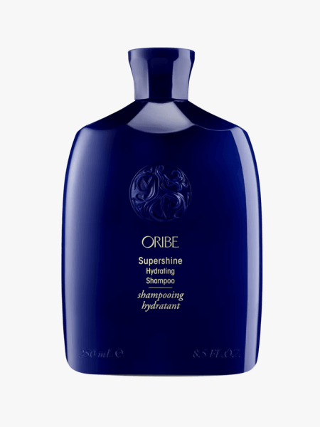 Oribe Supershine Hydrating Shampoo in branded component on a light gray background